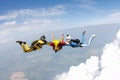 Skydiving. Two instructors are training a student to fly. Royalty Free Stock Photo