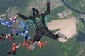 Skydiving. A cameraman makes photo and video about free falling skydivers.