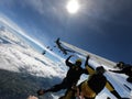 Skydiving formation above the clouds Royalty Free Stock Photo