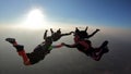 Skydiving group silhouette at the sunset. Royalty Free Stock Photo