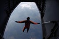 Skydiving. Skydiver is jumping out of a plane. The view from an airplane.