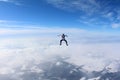 Skydiving. Skydiver is sitting above clouds.