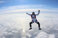 Skydiving. Skydiver is sitting above clouds.