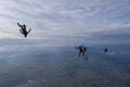 Skydiving. Skydivers are having fun in the cloudy sky. Royalty Free Stock Photo