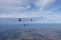 Skydiving. Skydivers are having fun in the cloudy sky. Royalty Free Stock Photo