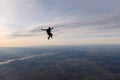 Skydiving. A solo skydiver is flying in the sky. Royalty Free Stock Photo