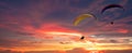 Skydiving Sunset Landscape Of Parachutist Flying In Soft Focus. Para-motor Flying Silhouette With Sun Set. Silhouette Of Paraglide