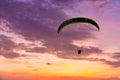 Skydiving sunset landscape of parachutist flying in soft focus. Para-motor flying silhouette with sun set. Silhouette of paraglide