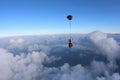 Skydiving. Tandem jump. Man and young woman are falling in the sky together.