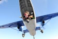 Skydiving. Tandem jump. Man and young woman are falling in the sky together. Royalty Free Stock Photo