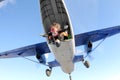 Skydiving. Tandem jump. Man and young woman are falling in the sky together.