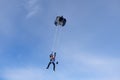 Skydiving. Tandem jump. Two skydivers are in the sky.