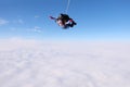 Skydiving. Tandem jump. Two skydivers are in the sky.