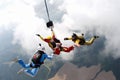 Skydiving. Two instructors are training a student to fly. Royalty Free Stock Photo