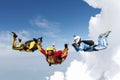 Skydiving. Two instructors are training a student to fly. Royalty Free Stock Photo