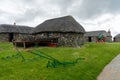 The Skye Museum of Island Life in Kilmuir on the coast of the Isle of Skye with thatched crofter cottages and boats