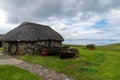 The Skye Museum of Island Life in Kilmuir on the coast of the Isle of Skye with thatched crofter cottages and boats