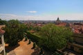 Skyline aerial view of old town Prague, ancient buildings and red tile roofs. Selective focus with wide angle lens