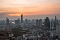 Skyline of Bangkok featuring a cluster of high-rise buildings and skyscrapers at sunset. Royalty Free Stock Photo