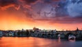 Skyline of Charles bridge and Prague castle on Vltava river during afternoon. Storm clouds with red color. Old Town, Prague, Euro Royalty Free Stock Photo