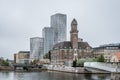 Skyline and Cityscape of new and old buildings in Malmoe, Sweden, against a grey sky Royalty Free Stock Photo