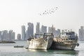 Skyline of Doha with traditional arabic dhows Royalty Free Stock Photo