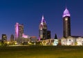 Downtown Mobile in Alabama with the three tallest city skyscrapers illuminated with neon lights in the evening.