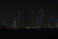 Beautiful night view of Dubai skyscrapers from the sea. skyline of Dubai Marina after sunset with a sea in the Royalty Free Stock Photo