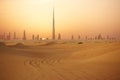 Skyline of Dubai at sunset or dusk, view from Arabian Desert Royalty Free Stock Photo