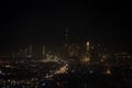 Skyline of Dubai in VAE including Burj Khalifa in the dark as seen from airplane Royalty Free Stock Photo