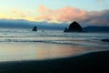 Skyline of Haystack rock at the Cannon beach captured against the cloudy sunset sky Royalty Free Stock Photo