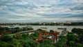 Skyline of Kolkata India from the side of howrah with on the boats on the river and green trees in the front