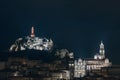 Skyline Le Puy-en-Velay in central France at twilight time; Cathedral and red christian statue Royalty Free Stock Photo