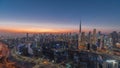 Skyline with modern architecture of Dubai business bay towers day to night . Aerial view Royalty Free Stock Photo