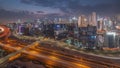 Skyline with modern architecture of Dubai business bay towers day to night timelapse. Aerial view Royalty Free Stock Photo