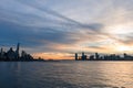 Skyline of the New York City Financial District and the Jersey City Skyline along the Hudson River during a Sunset Royalty Free Stock Photo