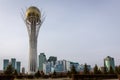 Skyline of Nur Sultan city with Baiterek Bayterek Tower and business district in autumn.