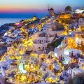 Skyline of Oia Town with Traditional White Architecture and Iconic Windmills in Village of Santorini in Greece Royalty Free Stock Photo