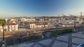 Skyline over Lisbon commercial port timelapse, 25th April Bridge, containers on pier with freight cranes Royalty Free Stock Photo