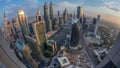 Skyline panorama of the high-rise buildings on Sheikh Zayed Road in Dubai aerial night to day timelapse, UAE. Royalty Free Stock Photo