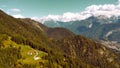 skyline and panorama of italian mountains and forest at the beginning of autumn, dolomite, shot with drone, veneto, belluno