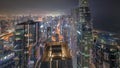 Skyline panoramic view of Dubai Marina showing canal surrounded by skyscrapers along shoreline all night timelapse Royalty Free Stock Photo