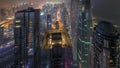 Skyline panoramic view of Dubai Marina showing canal surrounded by skyscrapers along shoreline all night timelapse Royalty Free Stock Photo