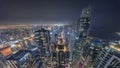 Skyline panoramic view of Dubai Marina showing canal surrounded by skyscrapers along shoreline all night timelapse Royalty Free Stock Photo