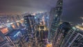 Skyline panoramic view of Dubai Marina showing canal surrounded by skyscrapers along shoreline all night timelapse Royalty Free Stock Photo