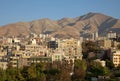 Skyline of Residential Buildings in Front of Brown Mountains and Clear Blue Sky of Tehran