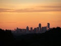 Skyline shot of Austin Texas downtown nestled between silhouetted hills Royalty Free Stock Photo