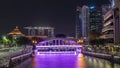 Skyline of Singapore financial district behind Elgin Bridge and the Singapore River night timelapse hyperlapse Royalty Free Stock Photo