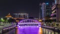 Skyline of Singapore financial district behind Elgin Bridge and the Singapore River night timelapse hyperlapse Royalty Free Stock Photo