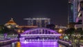 Skyline of Singapore financial district behind Elgin Bridge and the Singapore River night timelapse hyperlapse Royalty Free Stock Photo